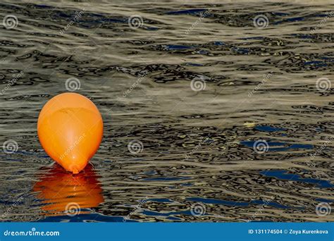 Orange Balloon in the Water of the River. Stock Photo - Image of ...