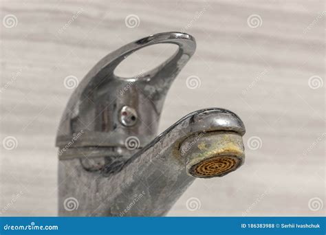 Old Bathroom Sink Faucet Contaminated With Calcium Grime And Rust