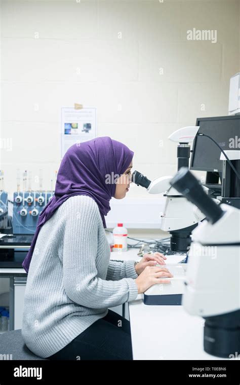 A Muslim Woman Uses The Scientific Equipment In A Research Laboratory At The University Of