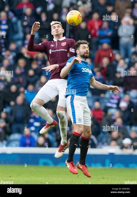 Rangers' Russell Martin (right) and Hearts' Kyle Lafferty (left) battle ...