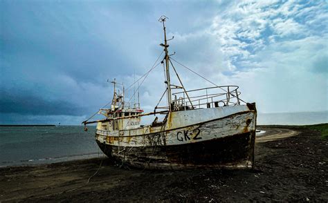 A Rusted Boat Sitting On Top Of A Beach Photo Free Snæfellsnes Image