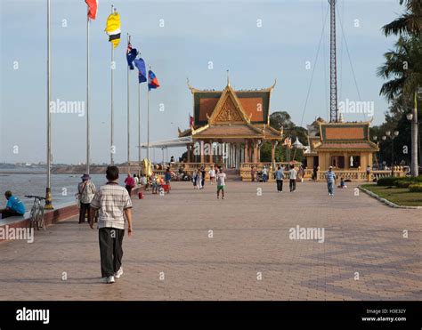 People Walking On Sisowath Quay Promenade Towards Preah Ong Dong Ar