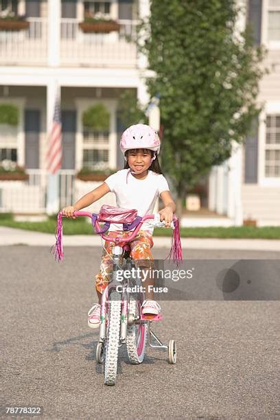 152 Girls Bike With Training Wheels Stock Photos, High-Res Pictures, and Images - Getty Images