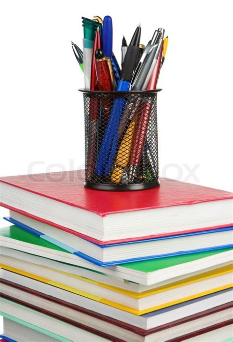 Books And Holder Basket In Pens Isolated On White Stock Photo Colourbox