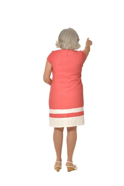 Premium Photo Mature Woman In Pink Dress Back View