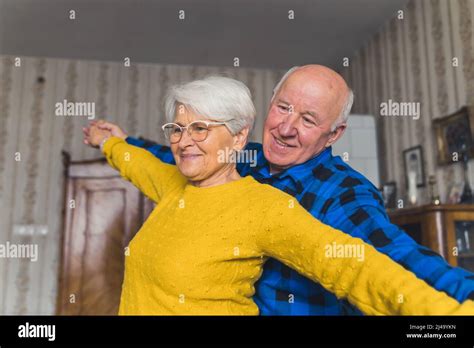 Elderly Caucasian Couple Grandmother And Grandfather Dancing