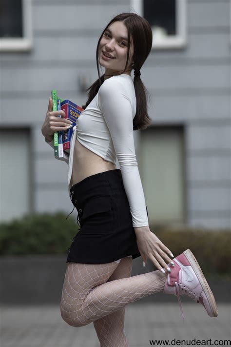 Lovely Brunette Hottie Teasing With Her Amazing Body On The Couch Photos