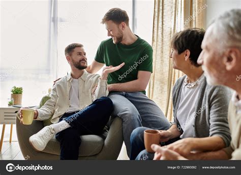 Gay Couple Sits Parents Living Room Having Conversation Stock Photo HayDmitriy