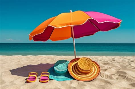 Premium Photo A Colorful Beach Umbrella And A Pair Of Flip Flops Sit On A Beach