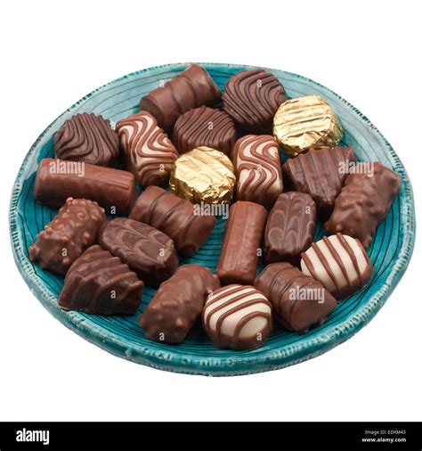 Plate Of Chocolates Isolated On White Background Stock Photo Alamy