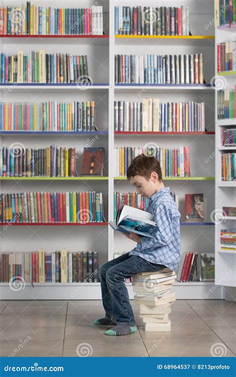 Cute Boy Reading Book In Library Stock Image Image Of Childhood