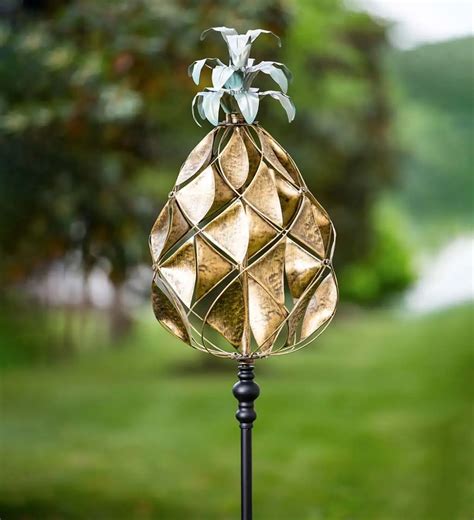 This Stunning Verdigris And Golden Metal Pineapple Statement Wind