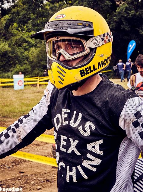 A Man Wearing A Yellow Helmet And Holding His Arms Out To The Side With