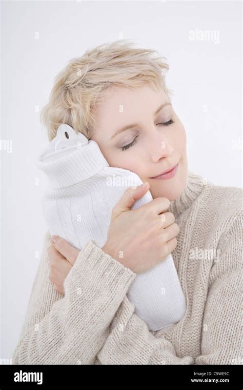Woman Holding Hot Water Bottle Eyes Closed Portrait Stock Photo Alamy