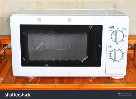 Microwave Oven On The Table In Kitchen Stock Photo 159541736 Shutterstock