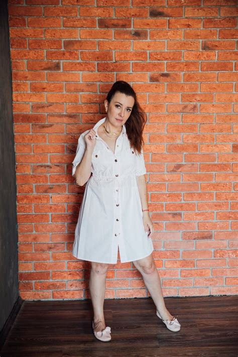 Year Old Brunette Woman Standing By A Brick Wall Stock Image Image Of Smartphone Summer
