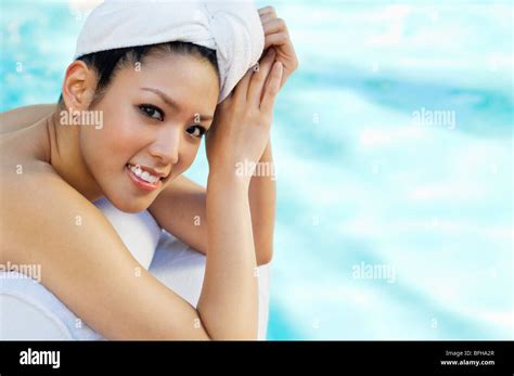 Young Woman Lying By Swimming Pool Portrait Stock Photo Alamy