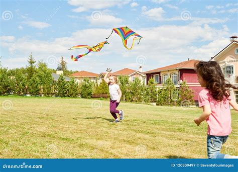 Two Girls Running With Kite Stock Image Image Of Lawn Happy 120309497