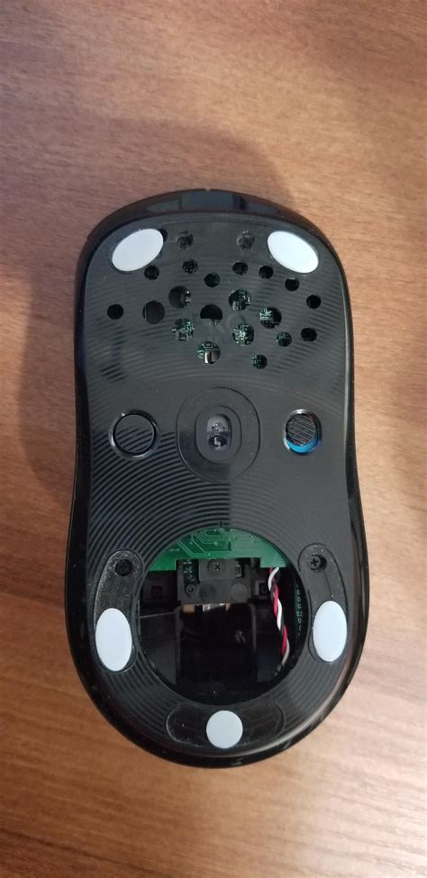 Some holes on my mouse. I drilled some holes and took out the side pcb. Achieved that 67 gram ...