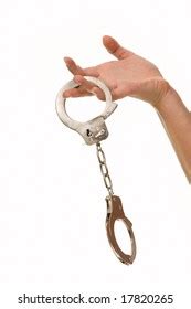 Womans Hand Holding Handcuffs Isolated On Stock Photo Edit Now