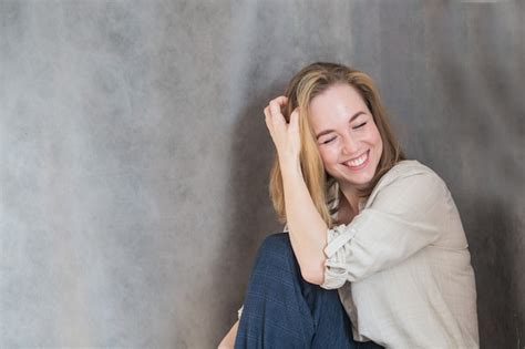 Premium Photo Happy Beautiful Blonde European Woman Touch Her Hair