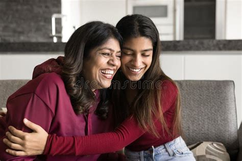 Cheerful Indian Daughter And Mature Mother Hugging With Heads Touch Stock Image Image Of Older