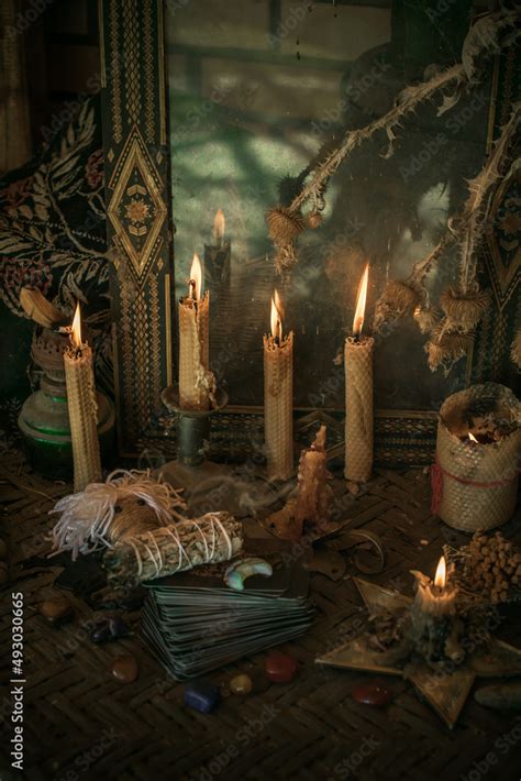 Candle burns on the altar, powerful magic among candles, pagan or wicca ...