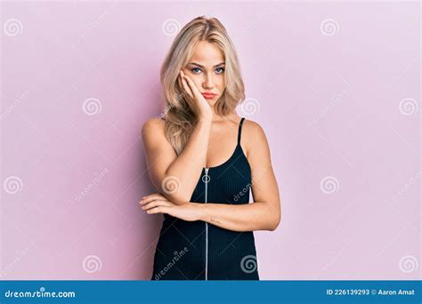 Beautiful Caucasian Blonde Girl Wearing Party Dress Thinking Looking