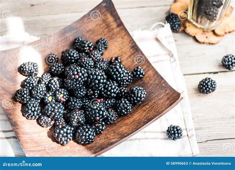 Organic Blackberries In A Glass On A Wooden Plate Rustic Stock Image