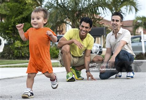 Child With Two Dads High-Res Stock Photo - Getty Images