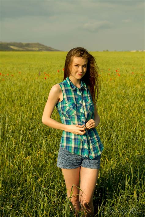 Solo Girl Emily Bloom Playing With Her Big Tits Outdoors Photos