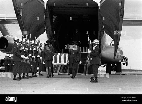 An Air Force Honor Guard Stands At Attention While The Casket Of An MIA