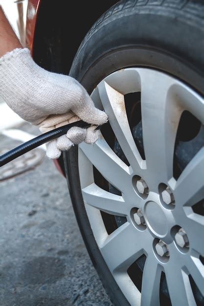 Premium Photo Pumping Car Tires In The Service Station