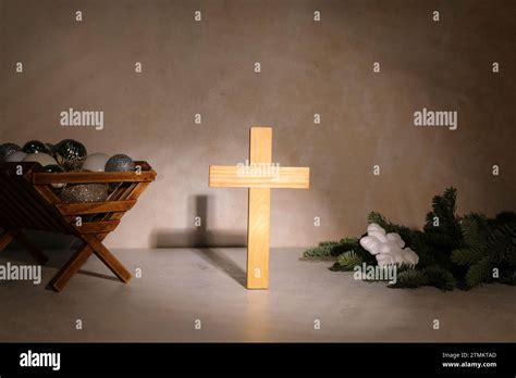 Cross With Manger And Decorations On Grunge Background Concept Of