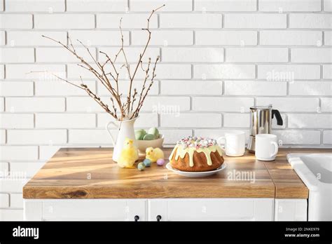Easter Cake With Painted Eggs Pussy Willow Branches And Baby Chickens On Kitchen Counter Stock