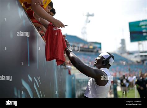 Kansas City Chiefs Linebacker Willie Gay Signs Autographs For Fans In The Stands Before An NFL