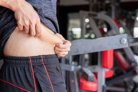 Fat Man Holding Excessive Fat Belly Overweight Fatty Belly At Fitness