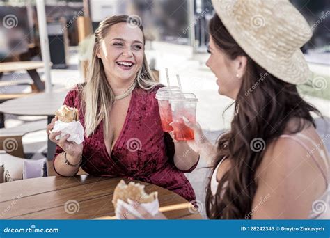 Happy Joyful Women Cheering With Glasses Of Lemonade Stock Image