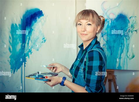 Beautiful Blonde Woman Painter In Her Studio Stock Photo Alamy