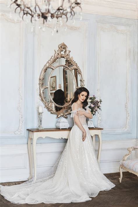 Beautiful And Sensual Brunette Model Girl In Stylish Lace Dress With Naked Shoulders Posing In