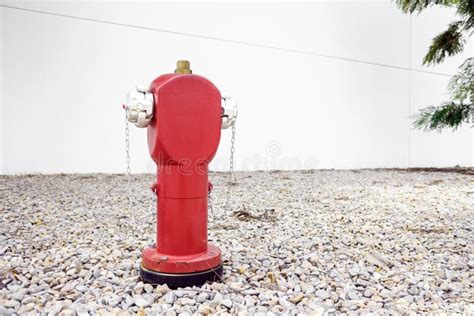 Red Metal Fire Hydrant On The Street In An Industrial Area For Fire