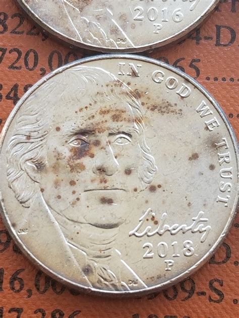 Coin collectors argue over the grading of valuable american nickels 38