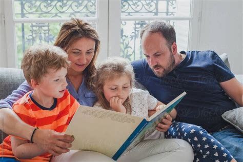 "Family Time, Parents Reading Book To Children" by Stocksy Contributor "Anna Berkut" | Books to ...