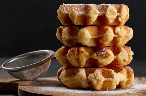 Premium Photo A Stack Of Baked Belgian Waffles Sprinkled With