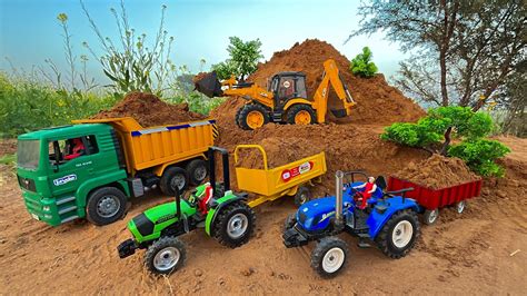 Jcb Cx Backhoe Fully Loading Sand In Mini Tractor Trolley Sonalika