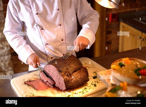 Chef Carving Roast Beef Stock Photo Alamy