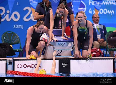 Cate Campbell Of Australia Reacts With Team Mates Emily Seebohm Emma