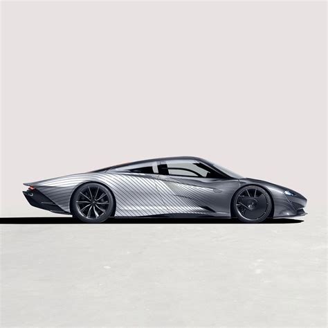 A Silver Sports Car Is Shown From The Side On A Plain Surface With No