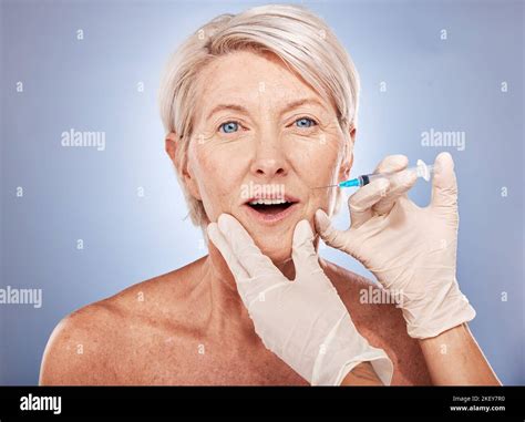 Senior Woman Botox Injection And Syringe With Hand For Cosmetic Surgery Anti Aging And Beauty