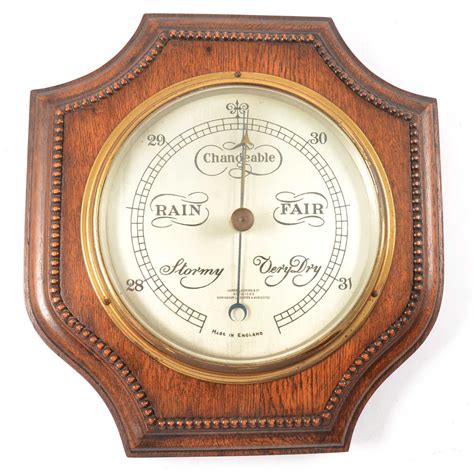 Lot 379 Oak Cased Aneroid Barometer And An Oak